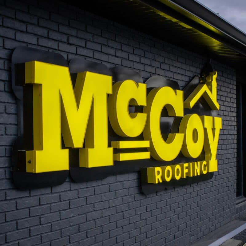 McCoy Roofing Logo on Building