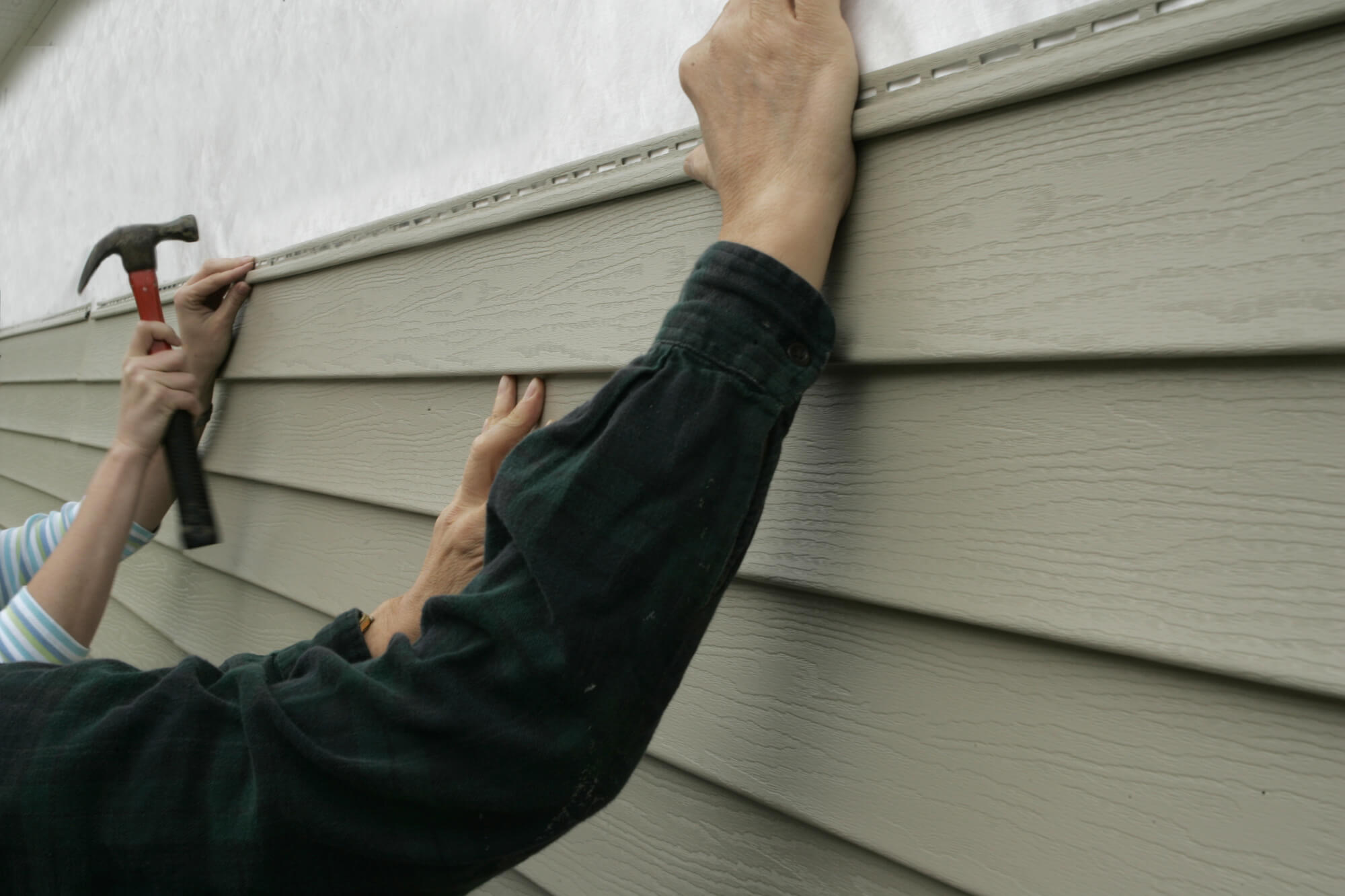 Vinyl Siding Vs Brick McCoy Roofing   Installing Siding On A House 