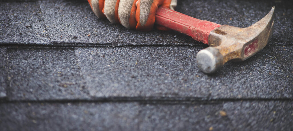 roofer repairing roof