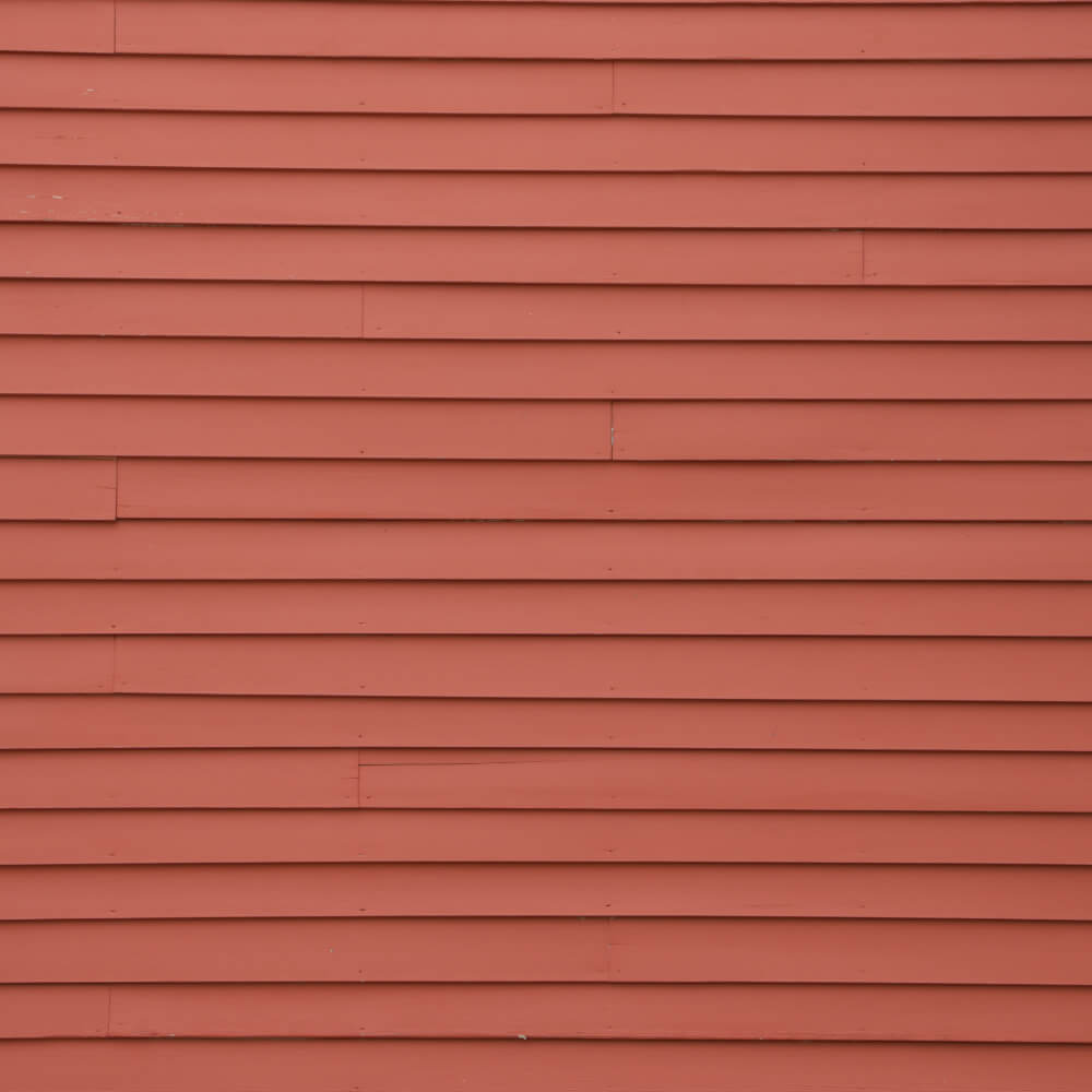 Picture displaying Vinyl Siding installed on a home, one of the different materials used for siding.