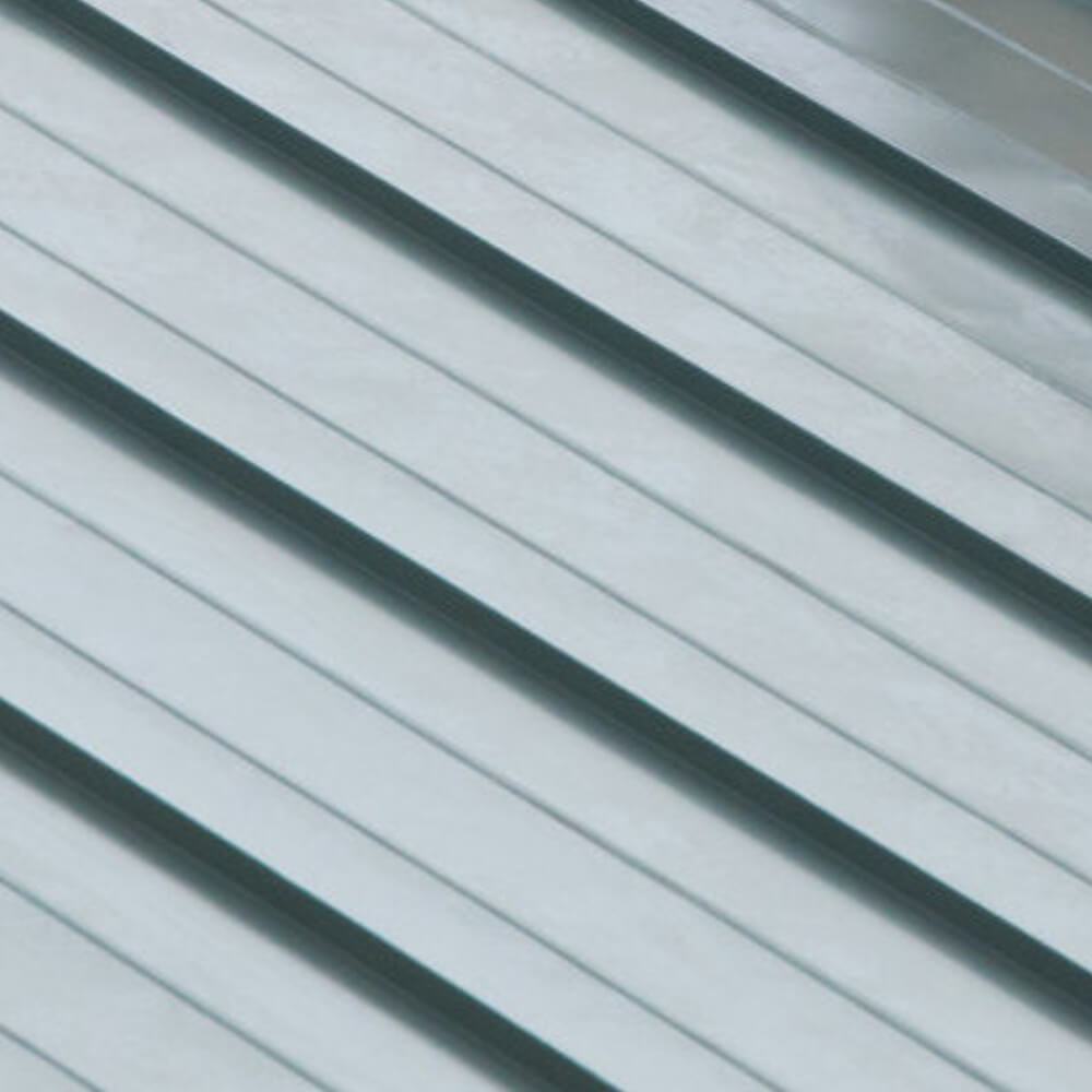 Close up picture of a metal roof placed on a customer's house.