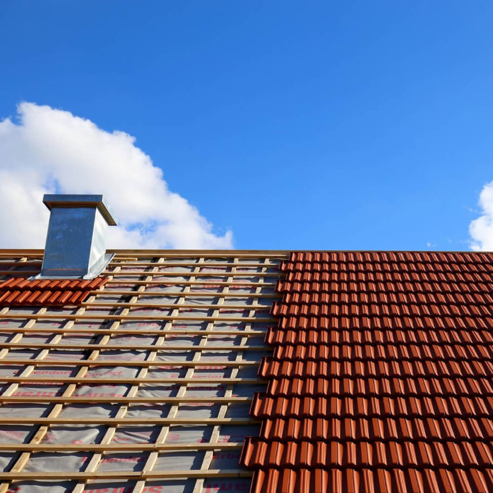 A roof having its replacement done, half roof done and the underlayment is visible on the left side.