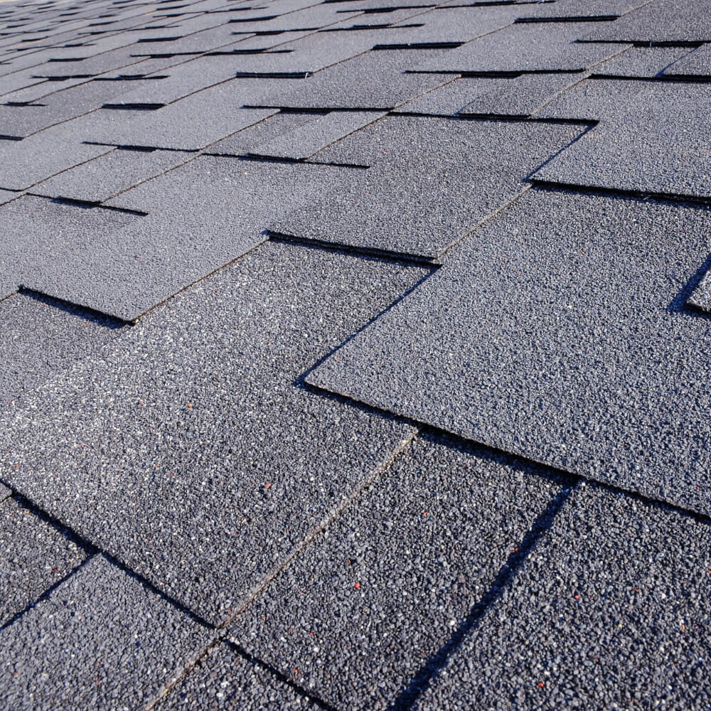 Close up of a roof's shingles after being replaced with a McCoy Roofing's roof.