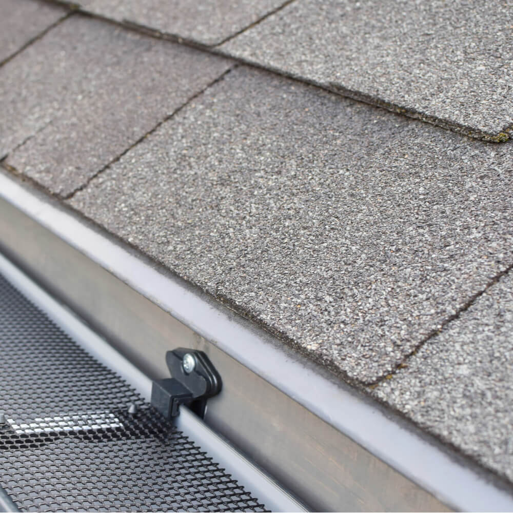 Close up picture of asphalt shingles after a roof replacement done by McCoy Roofing.