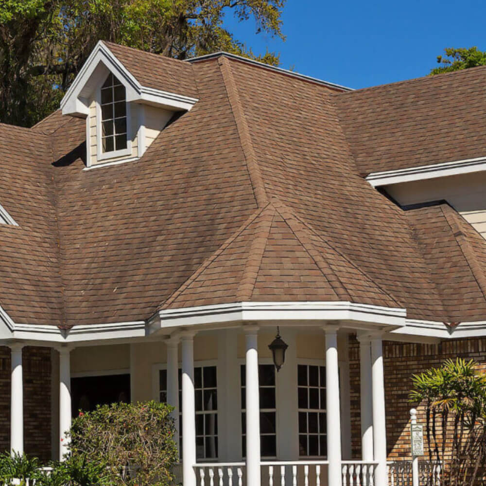 Roof of a house before having a roof replacement done by McCoy Roofing.