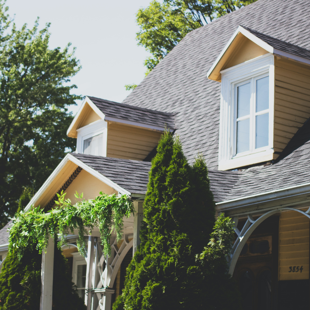 Front shot of a house after having its roof replacement during spring.