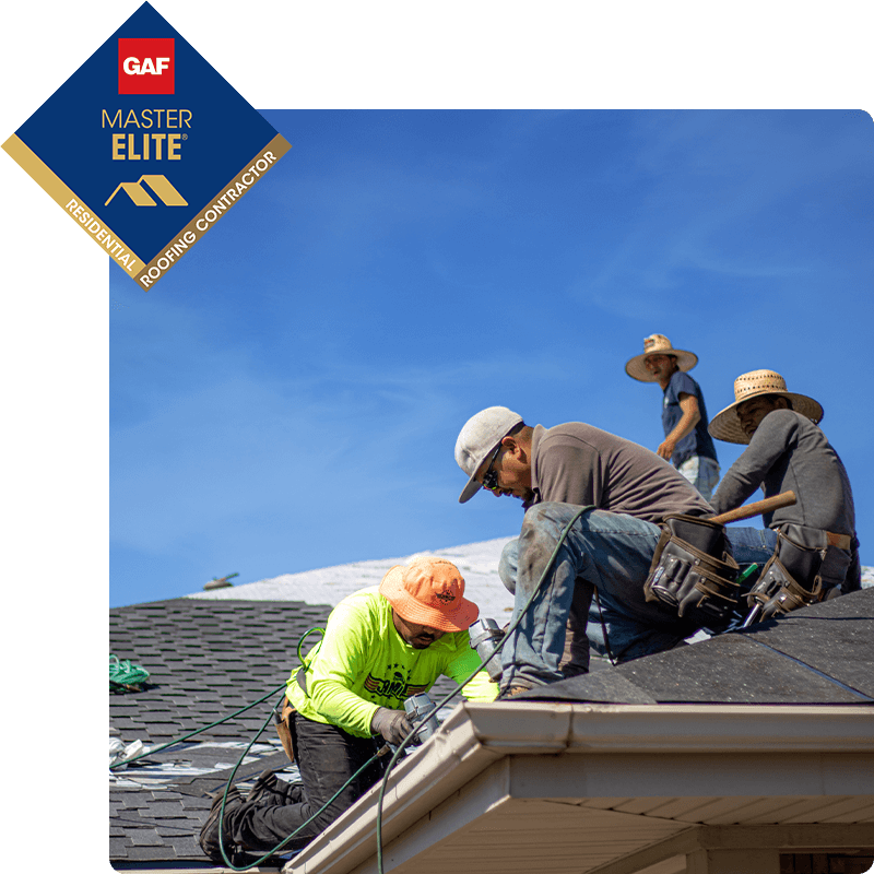 McCoy Roofing workers on a roof.