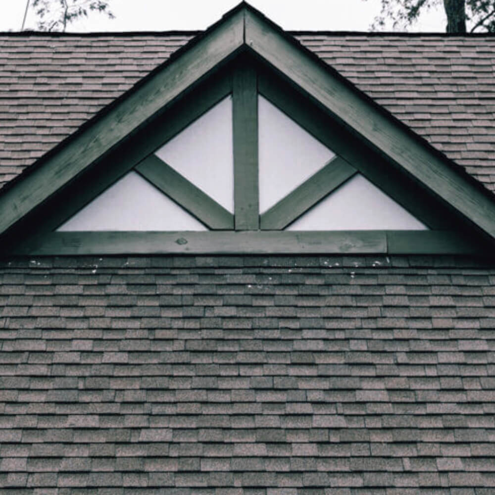 Close up shot of a rooftop displaying McCoy Roofing's roof