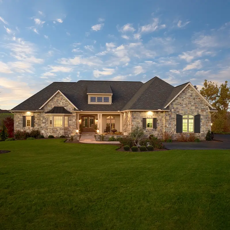 Complete roof replacement on a home pictured at sunset. 